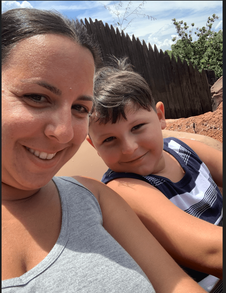 A woman and child smiling for the camera.