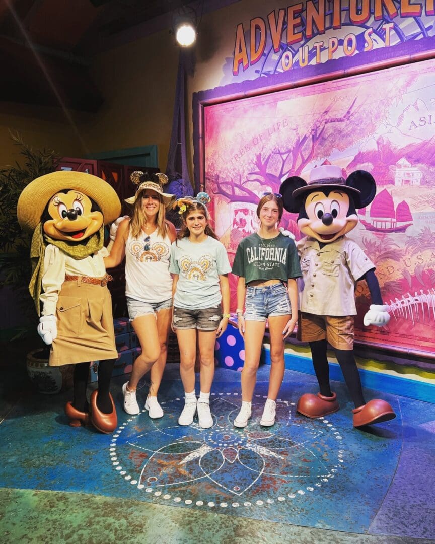 Mickey and Minnie meet three girls at Disney.