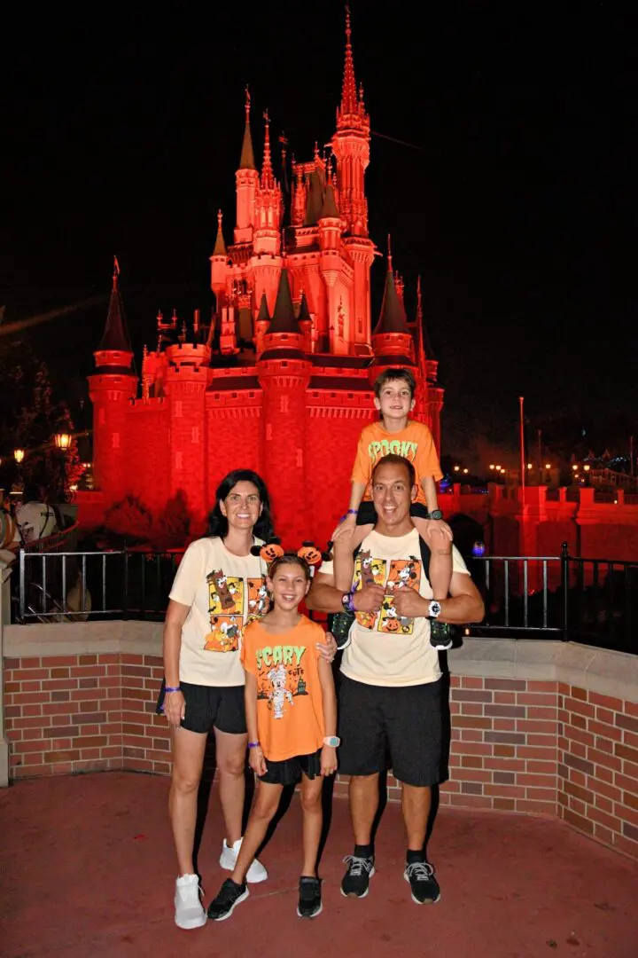 Family in front of Cinderella's Castle.