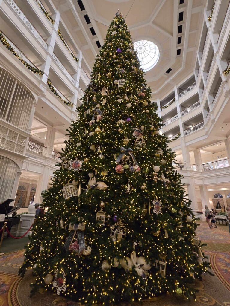 Large, ornate Christmas tree in hotel lobby.