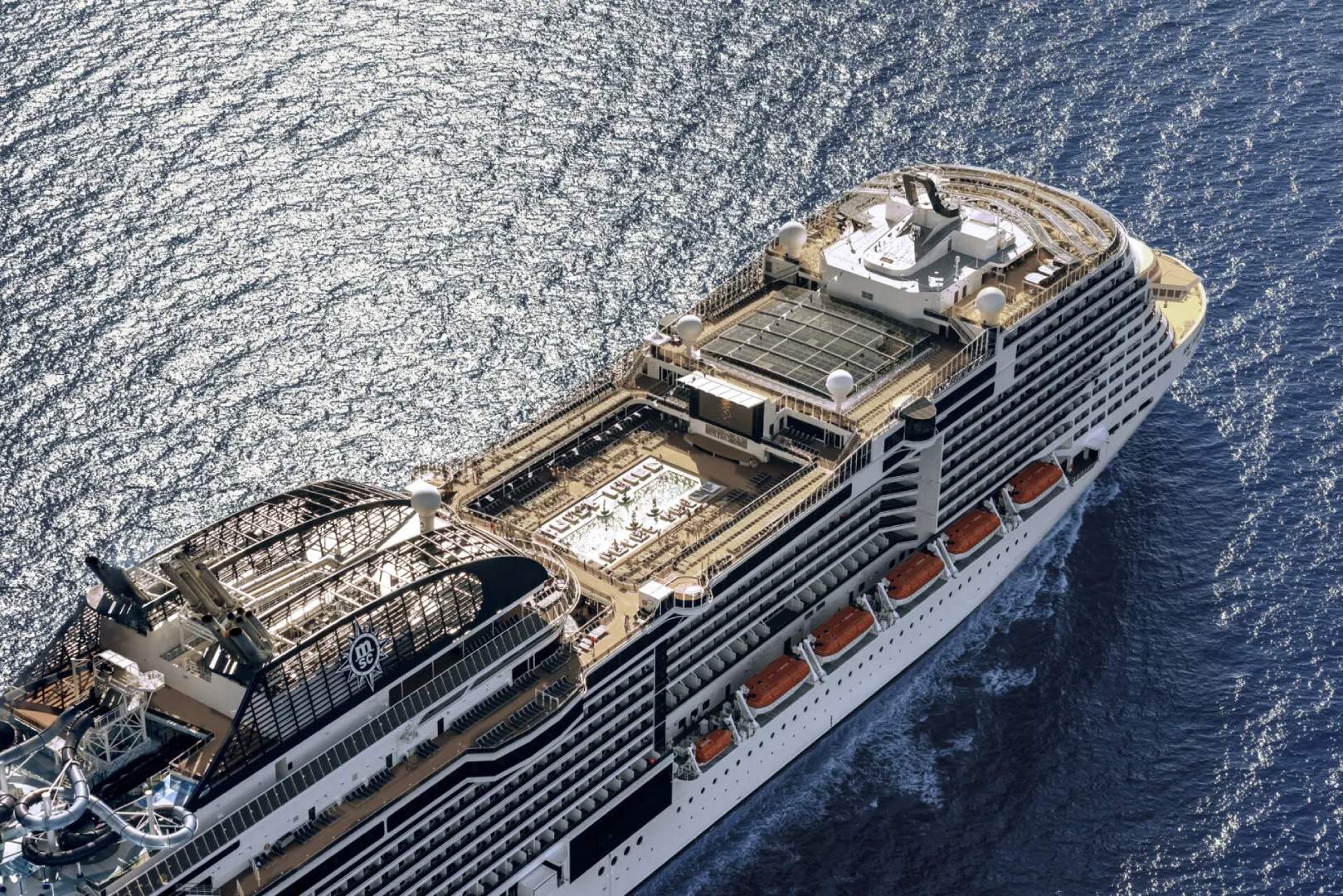 A cruise ship is shown from above in the ocean.