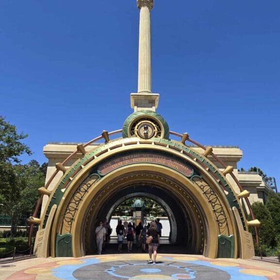 Colorful archway entrance with tall spire.