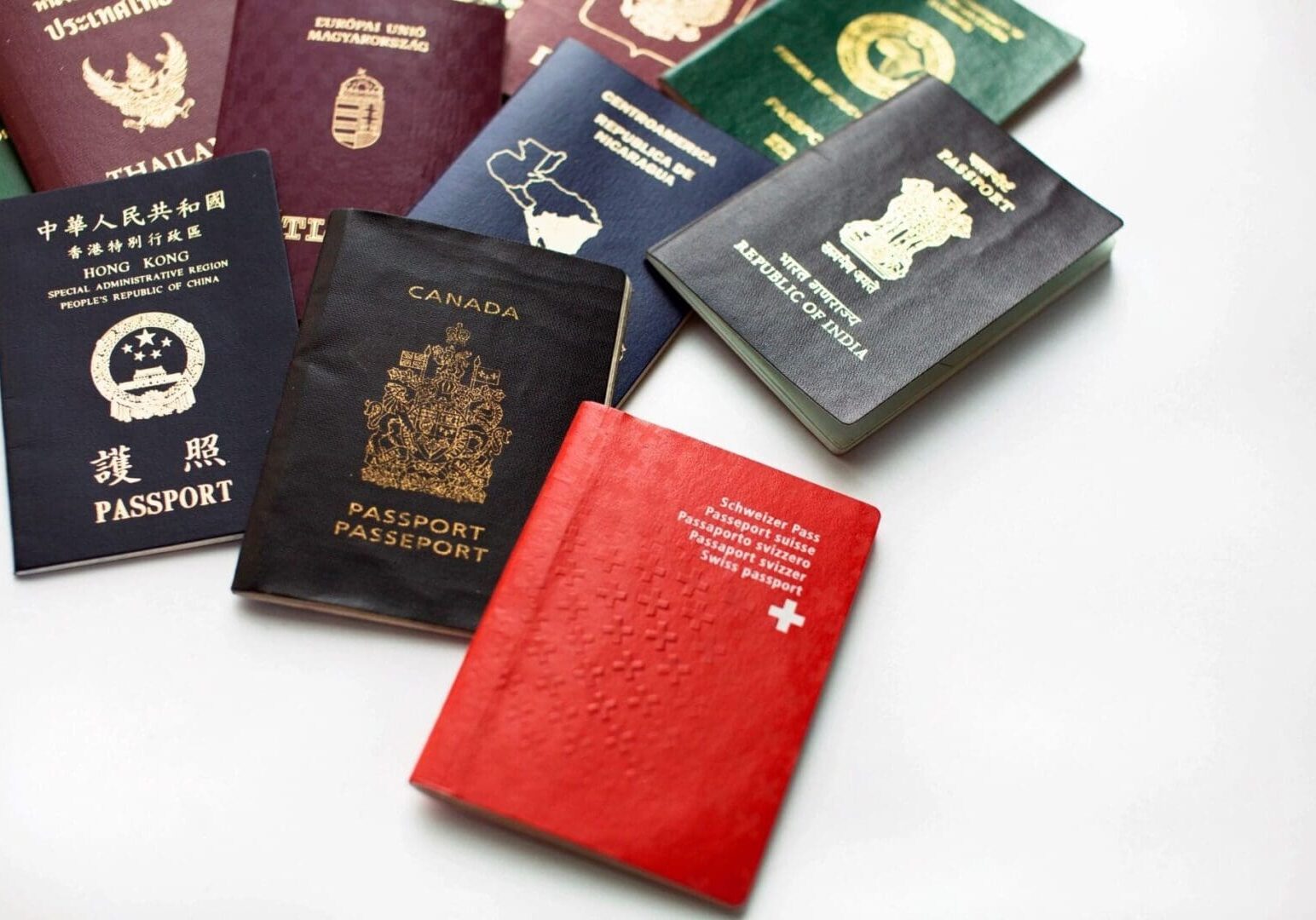 Various international passports on a white background.