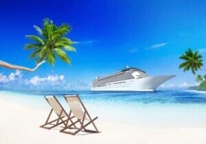 Cruise ship on a tropical beach.